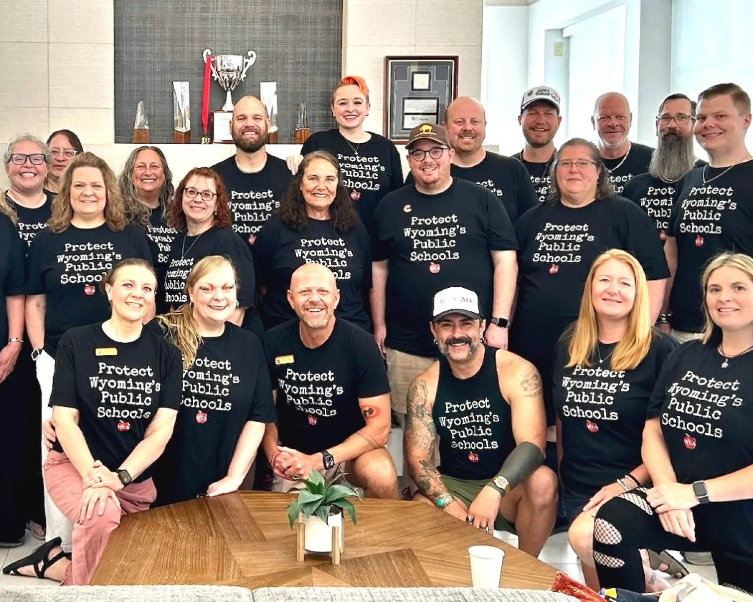 group picture of WEA staff and advocates wearing shirts that say "Protect Wyoming's Public Schools"